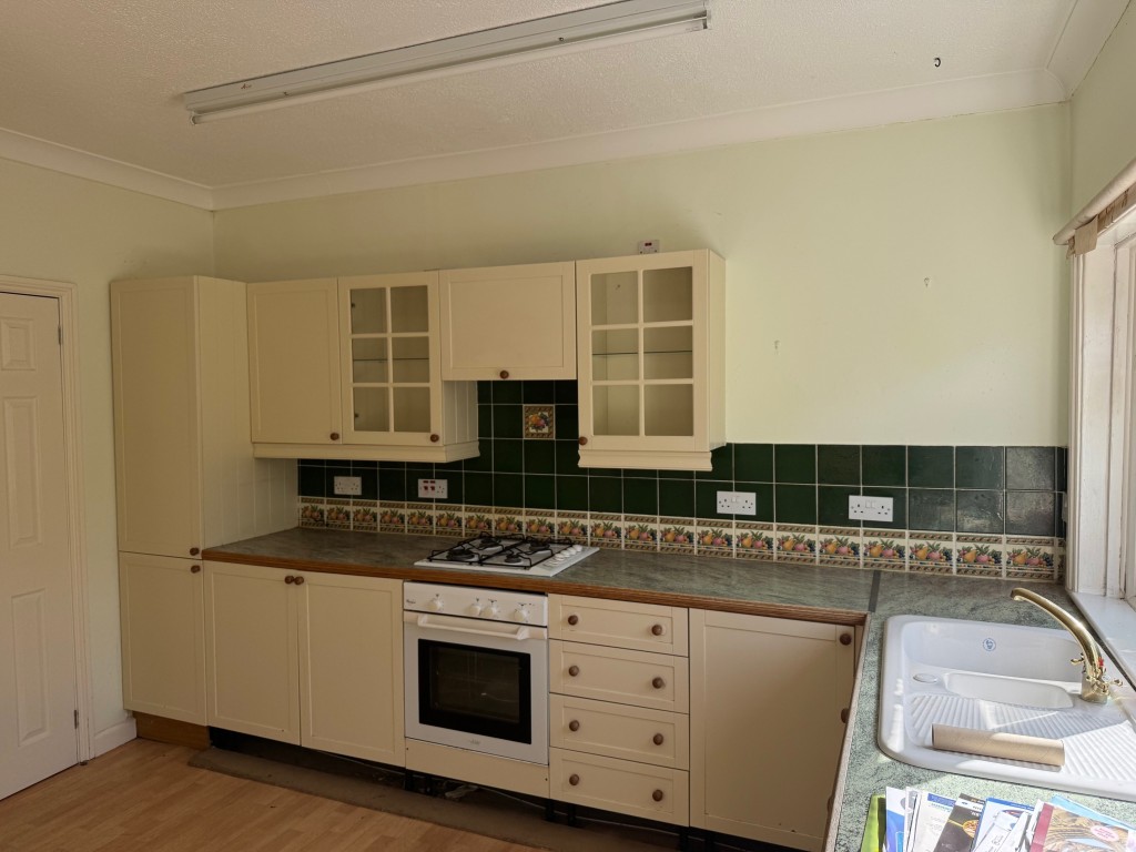 Lot: 130 - TWO-BEDROOM HOUSE FOR IMPROVEMENT - A view of the kitchen